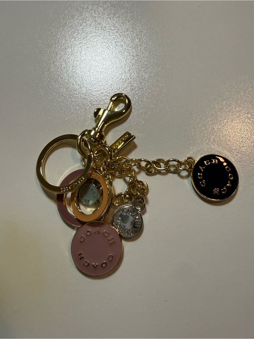 Coach Gold-Tone Pink and Black Disc Charm Keychain